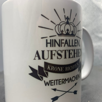 Tasse mit Spruch "Hinfallen, Aufstehen, Krone richten weitermachen" Kaffeetasse